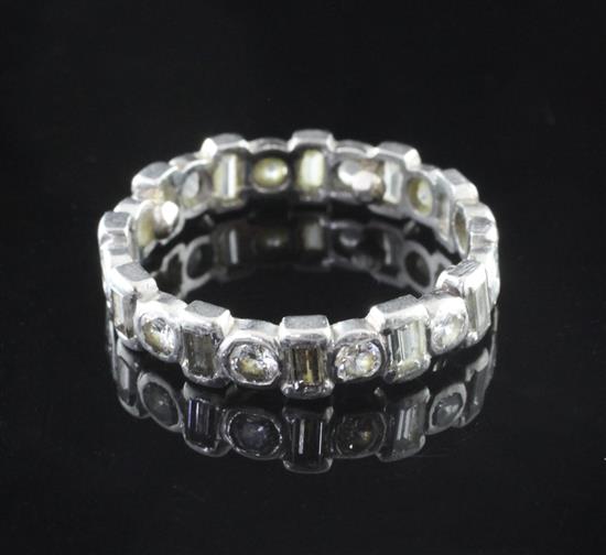 A 1940s/1940s white gold and diamond full eternity ring, size J.